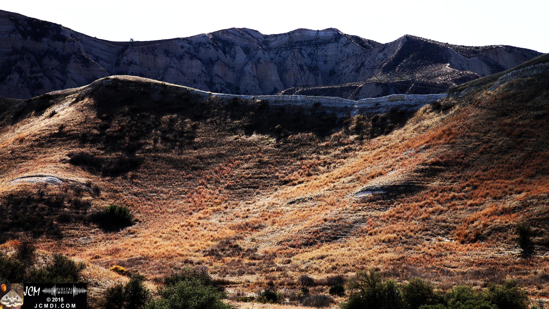 Landslide, buckled pavement, and terrain at Vasquez Canyon Road in Santa Clarita, CA filmed 11-25-2015
